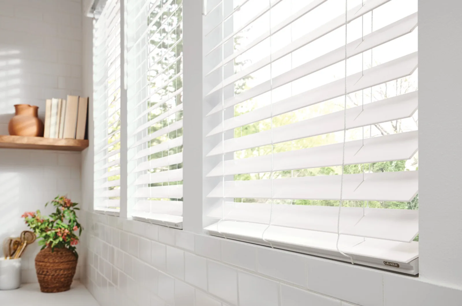 White faux wood blinds in a bright South Jordan bathroom