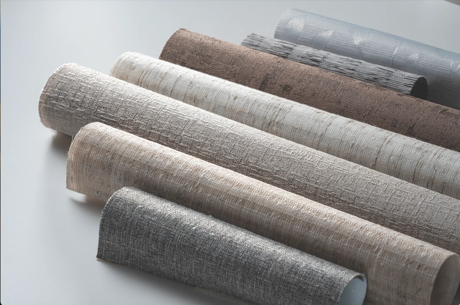 Rolled shade and blind samples in neutral textures
